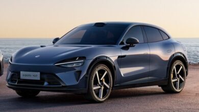 Official teaser image of the Xiaomi YU7 electric SUV in red, side profile view