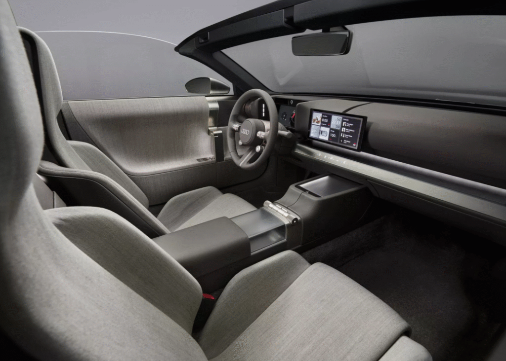 Minimalist interior of the Audi Concept C with digital instrument cluster and shy tech infotainment