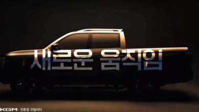 Teaser front view of the KG Mobility Q300 pickup with illuminated five-slot grille