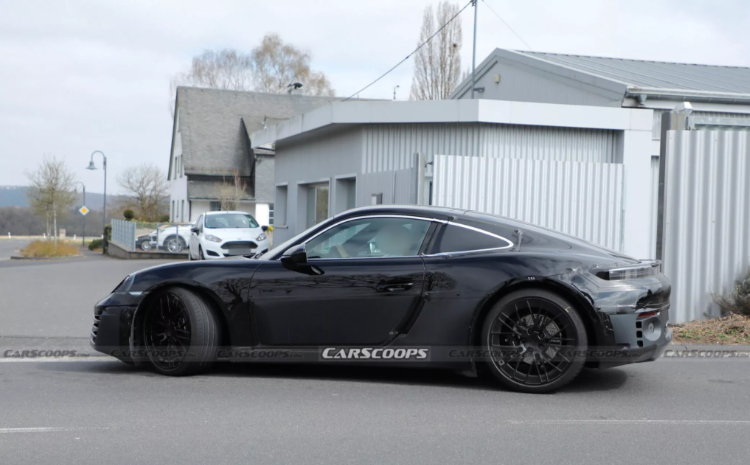 Porsche EV prototype during testing with camouflage wrap