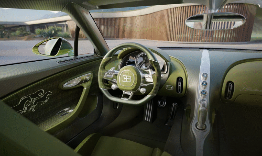 Interior of Bugatti Brouillard featuring green tartan fabric and horse sculpture shifter