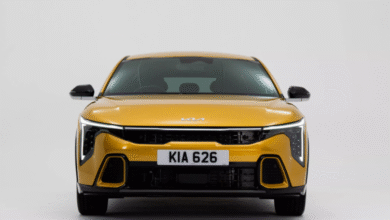 2025 Kia K4 hatchback front view in metallic blue