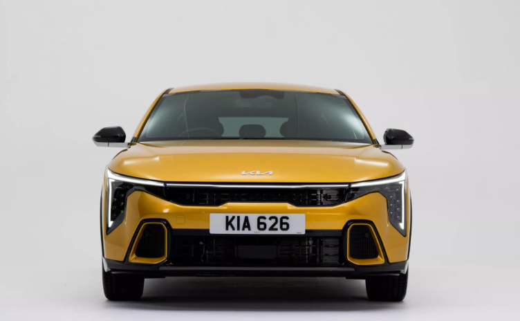 2025 Kia K4 hatchback front view in metallic blue