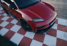 Front view of Porsche Macan GTS Electric in Lugano Blue with black accents