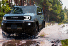 2026 Toyota Land Cruiser FJ front view with round LED headlights and rugged bumper